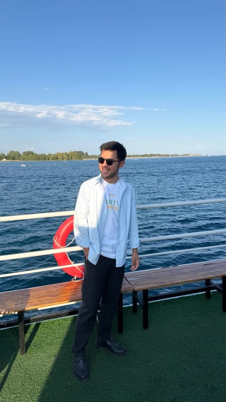 Halim on a boat beside the lake